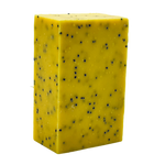 A rectangular bar of yellow soap with small black specks embedded throughout, shown on a plain white background.